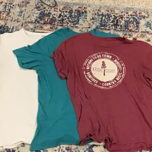 Men’s graphic tees- Maroon,teal,and white.